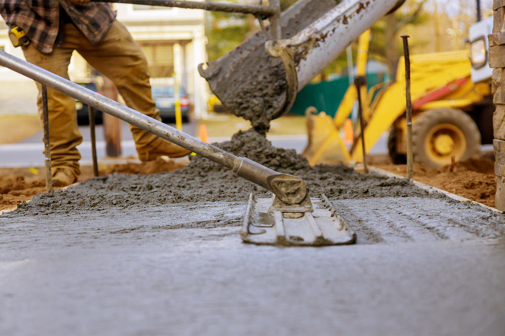 Close-up of a construction man paving at a site