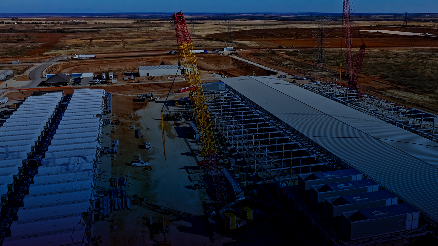 Cranes working on a large data center construction site