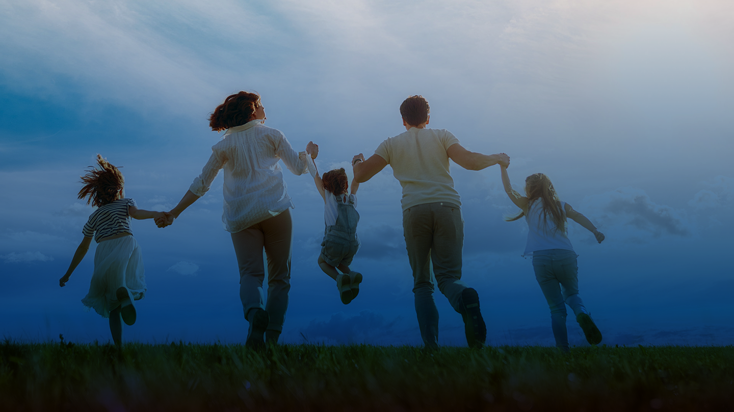 Family of five holding hands and having fun