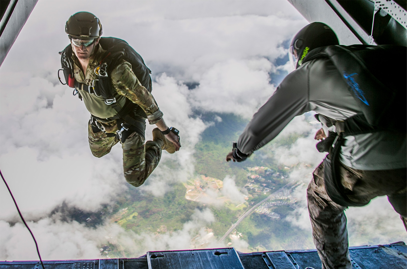American soldier jumping out of a helicopter